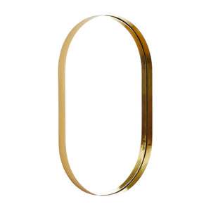 The Deep Frame Pill Mirror in Aged Brass, featuring an oval shape and hollow center like a brass-framed mirror, stands upright against a white background.