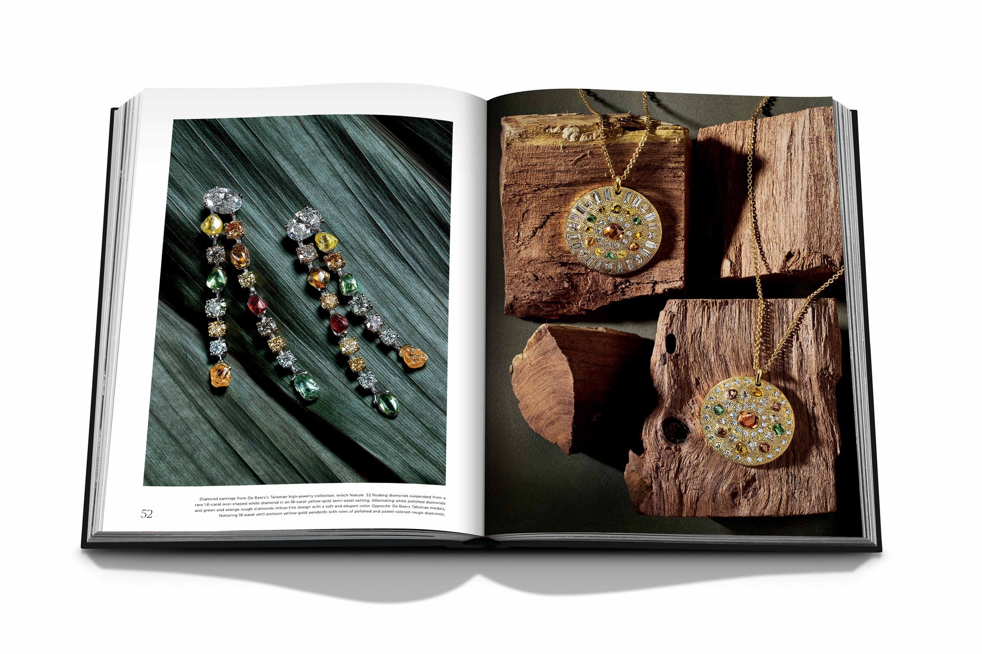 An open book displays an image of dangling earrings adorned with captivating stones on the left page and two gold pendants on a chain with natural diamonds on the right page, photographed on a wooden background. The book is titled *Diamonds: Diamond Stories*.