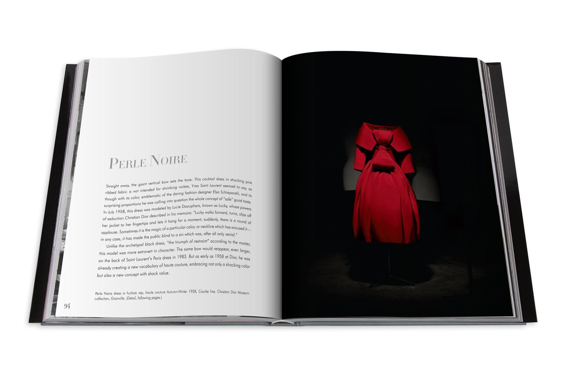 Open book showing a page with the title "Dior: Yves Saint Laurent" on the left and an image of a red dress, reminiscent of haute couture houses like Dior and Yves Saint Laurent, on the right.