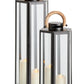 Two Napa Dockside Lanterns, crafted from black stainless steel and glass with natural teak wooden handles, each feature a lit white pillar candle.