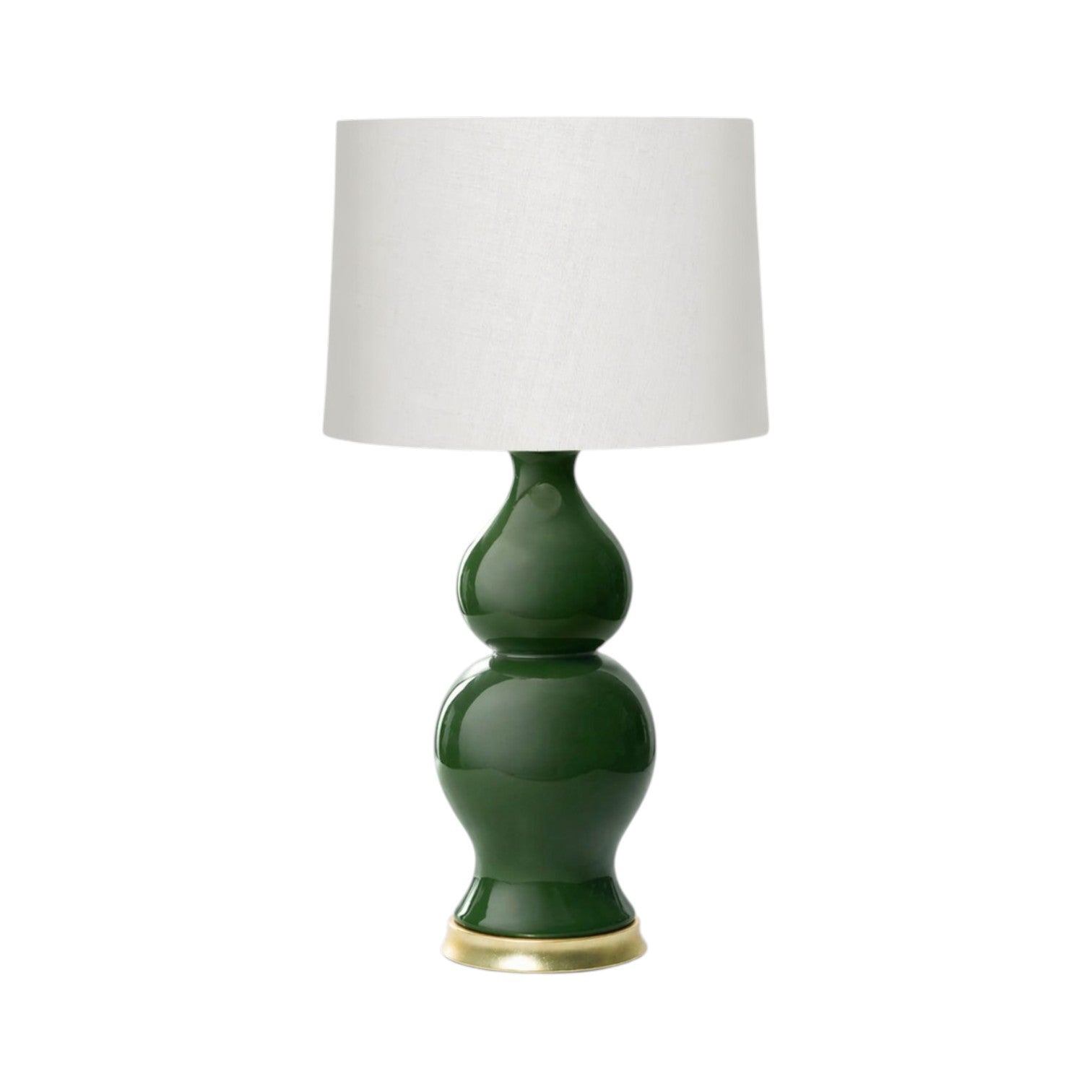 The Empire Table Lamp features a green ceramic rounded base with a brass-colored bottom and a white cylindrical fabric shade—an elegant choice for stylish entryway lighting.