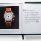 An open book displaying a luxury timepiece on the left page and a Shakespeare quote on the right: "O! Gentlemen, the time of life is short..." The book, featuring *The Impossible Collection of Rolex* from a collected watch label, is placed inside a green protective cover.