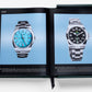 Open book displaying two luxury timepiece models on light blue backgrounds, with the left page showcasing a silver watch with a turquoise face from 2020, and the right page displaying a similar watch from 2022, both under The Impossible Collection of Rolex.