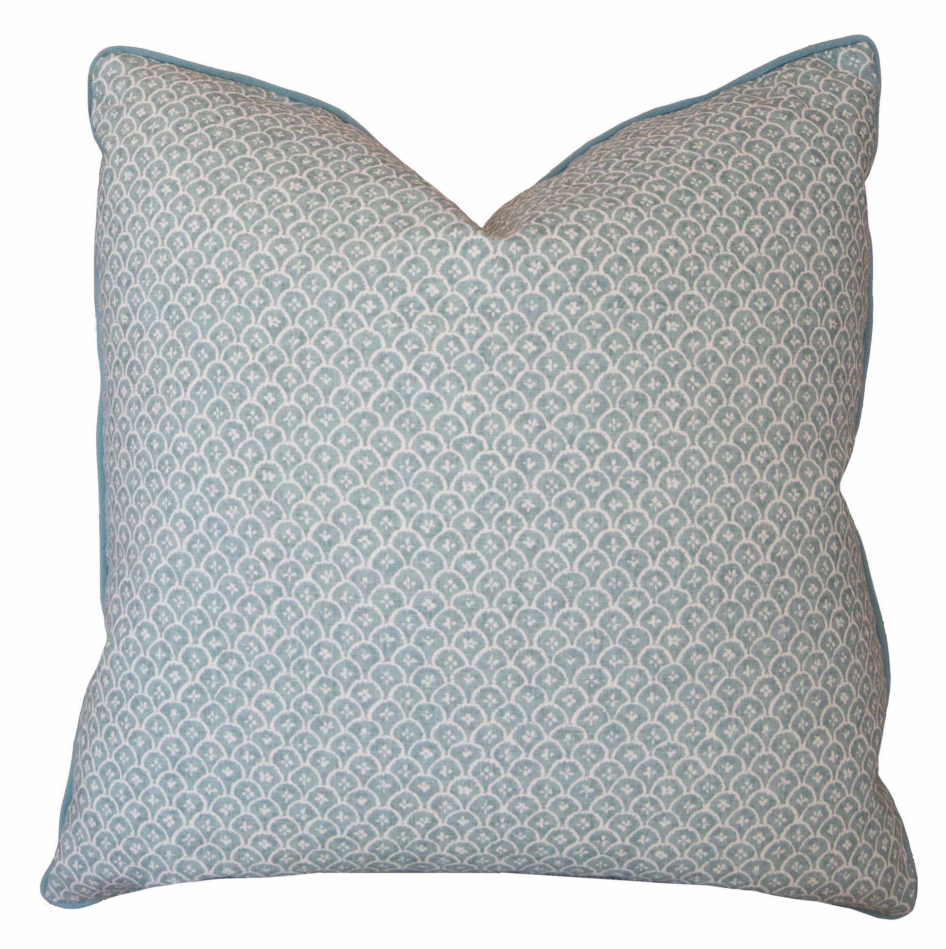The Zeimoto Dove Pillow is a custom-made square throw pillow with a light blue and white repeating scallop pattern, crafted from premium materials and shown against a white background.