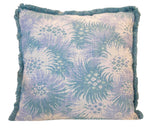 The Bimini Sea Glass Outdoor Pillow features a blue and white floral pattern with blue fringe, crafted from premium materials—an elegant addition to your pillow collection.