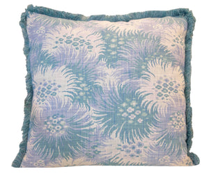 The Bimini Sea Glass Outdoor Pillow features a blue and white floral pattern with blue fringe, crafted from premium materials—an elegant addition to your pillow collection.