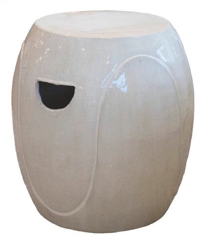 A White Wave Stool with a rounded shape, white glaze, and a cutout handle on the side.