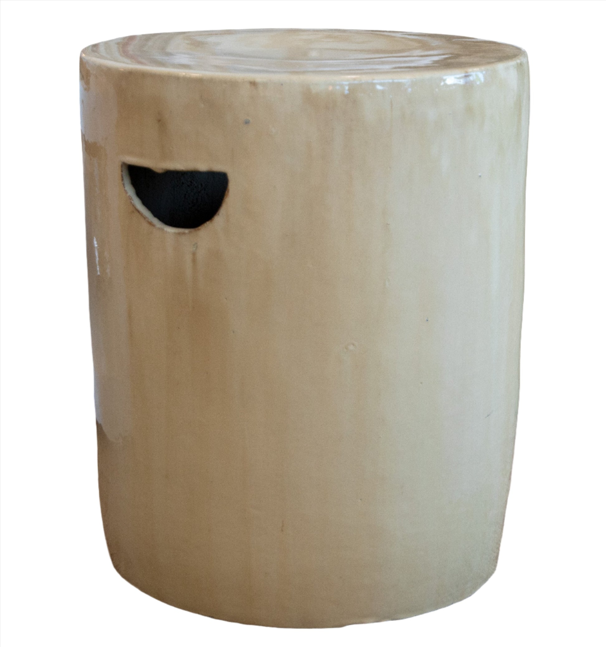 A beige Cylinder Stool with a latte glaze finish and a cutout handle on the side.