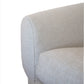 Close-up view of the arm and cushion of the light gray fabric Obi Sofa against a white background, capturing its modernist design and evoking a sense of relaxation.