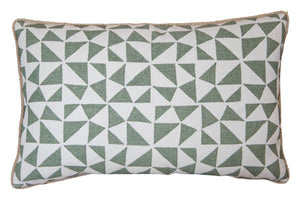 The Circus Lumbar Pillow is a custom-made rectangular pillow featuring a green and white geometric triangle pattern and finished with beige piping around the edges.