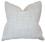 The Helios Olive Pillow is a square decorative pillow with a subtle small dot pattern on a light background, slightly pointed corners, and a soft, textured feel—crafted from premium materials for lasting comfort.