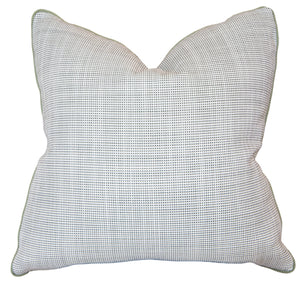 The Helios Olive Pillow is a square decorative pillow with a subtle small dot pattern on a light background, slightly pointed corners, and a soft, textured feel—crafted from premium materials for lasting comfort.