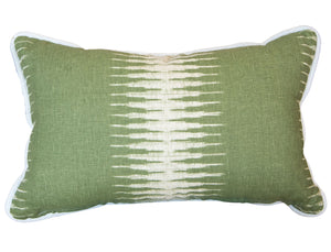 The Ikat Olive Lumbar Pillow is a custom-made rectangular green pillow with a white geometric center pattern and crisp white piping along the edges, crafted from the finest materials.