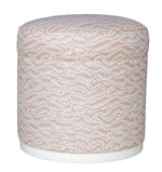 The Grant Swivel Ottoman features a round cushioned top with a Daphne Feathers Rose pattern and a white base, offering stylish comfort for elegant living spaces. Displayed on a plain white background.