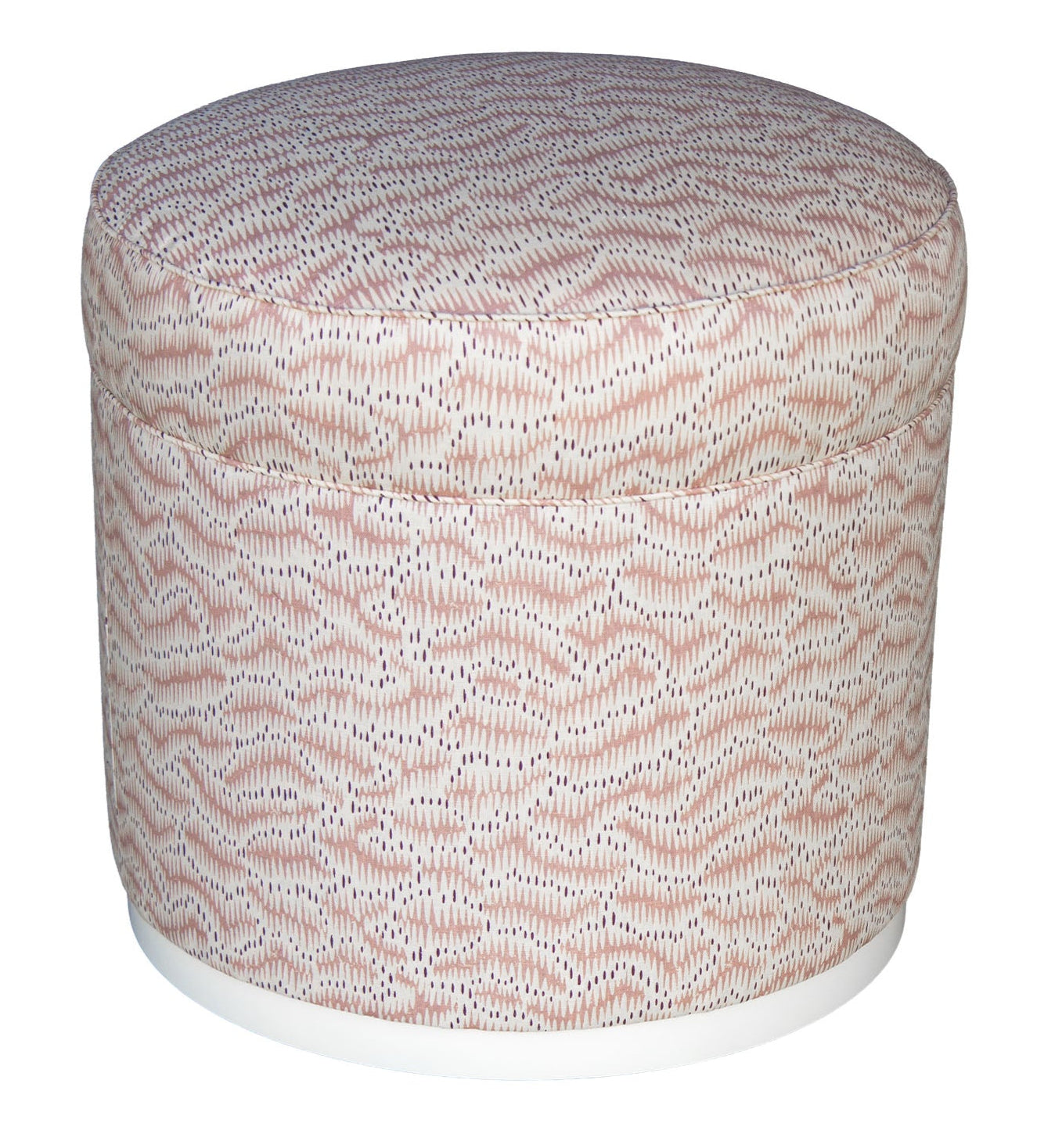The Grant Swivel Ottoman features a round upholstered design with pink and white patterned fabric and a white base, making it a charming addition to any elegant living space.