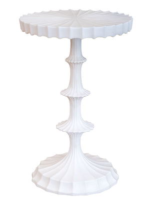 The Priscilla Side Table is a white, sculpted piece with a scalloped circular top and base, featuring fluted details and a tiered pedestal design for sophisticated style.