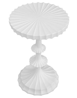 The Priscilla Side Table is a modern, white piece with sculptural design, featuring fluted details and a radial textured pattern on its round tabletop and base.