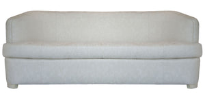 The Aldo Sofa is a light beige upholstered piece with a high back and minimalist design, adding sophistication. It has no visible cushions or decorations and is shown against a white background.