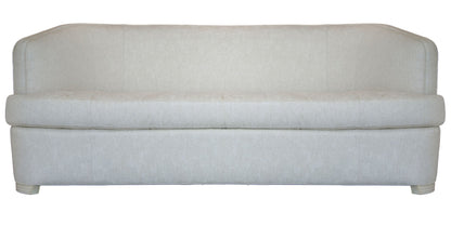 The Aldo Sofa is a light beige upholstered piece with a high back and minimalist design, adding sophistication. It has no visible cushions or decorations and is shown against a white background.