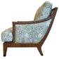 Side view of the St. Germain Lounge Chair, featuring a wooden upholstered frame, angled legs, and floral-patterned cushions in light blue and white tones, set against a white background.