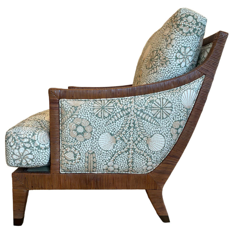 Side view of the St. Germain Lounge Chair, featuring a wooden upholstered frame, angled legs, and floral-patterned cushions in light blue and white tones, set against a white background.