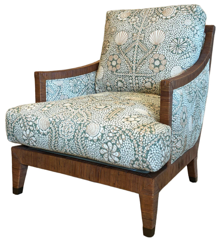 The St. Germain Lounge Chair features wooden armrests and legs, upholstered in blue and white floral and geometric fabric, inspired by classic French design.