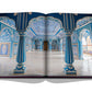 A hardcover book open to a photograph of an ornate, blue and white room with intricately detailed arches, columns, and ceiling designs, reminiscent of the Jaipur Splendor.