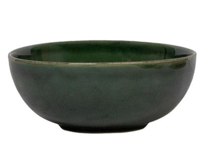 A simple Juliska Puro Basil Collection ceramic bowl, part of a dinnerware set, on a white background.