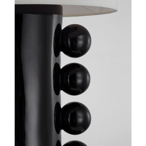 Close-up of the Tiglia Tall Table Lamp, Black, featuring a black base with four glossy, spherical accents and a white lampshade, embodying a contemporary accent reminiscent of Memphis Design.