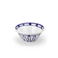 The Themis Z Kyma Blue Collection white ceramic bowl features harmonious blue geometric and dot patterns inspired by the Greek Aegean Sea, shown here against a plain white background.