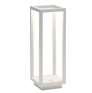 The Zafferano Home Pro Lamp, White, is a modern rectangular table lamp with integrated LED strips and an open frame design. Rechargeable and cordless, it provides stylish lighting indoors or outdoors without any hassle.