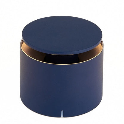 The Zafferano PushUp Pro Lamp Collection features a round, matte blue rechargeable table lamp with a matching lid and a slim gold rim near the top, displayed on a white background.