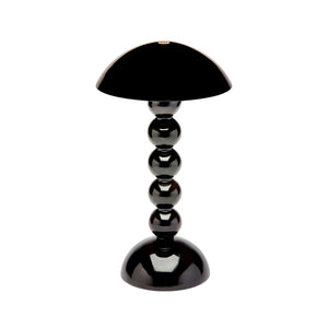 The Addison Ross Bobbin LED Cordless Lamp features a black dome-shaped shade and a base of four stacked spheres—perfect for al fresco dining or as a chic rechargeable lighting accent. Shown against a crisp white background.