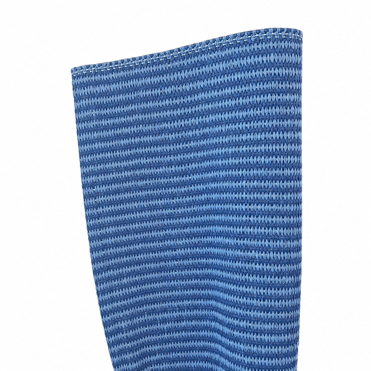 Close-up of the Lina Strie Rug, a blue hand-woven textile featuring a repeating pattern of small, evenly spaced horizontal lines.