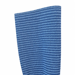Close-up of the Lina Strie Rug, a blue hand-woven textile featuring a repeating pattern of small, evenly spaced horizontal lines.