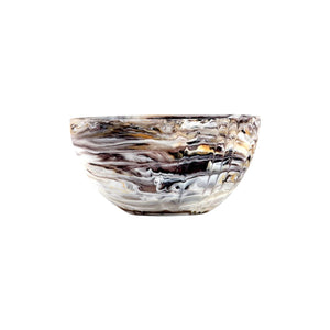 The Mocha Resin Serveware Collection features a shatter-resistant glass bowl with swirling brown, black, and white marbled patterns, adding elegant style and lasting durability to any home décor.