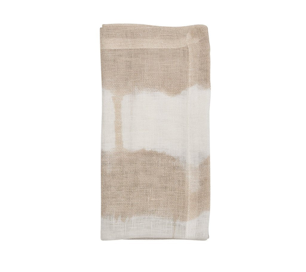 The KS Watercolor Stripe White & Natural is a folded beige and white linen napkin featuring an abstract, watercolor-inspired stripe design—ideal for adding a touch of sophistication to your summer table.