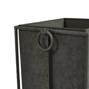 Close-up of a Callahan Gray Metal Planter—sleek, dark gray square design with textured surface and large circular ring handle, blending contemporary elegance for versatile indoor or outdoor use.