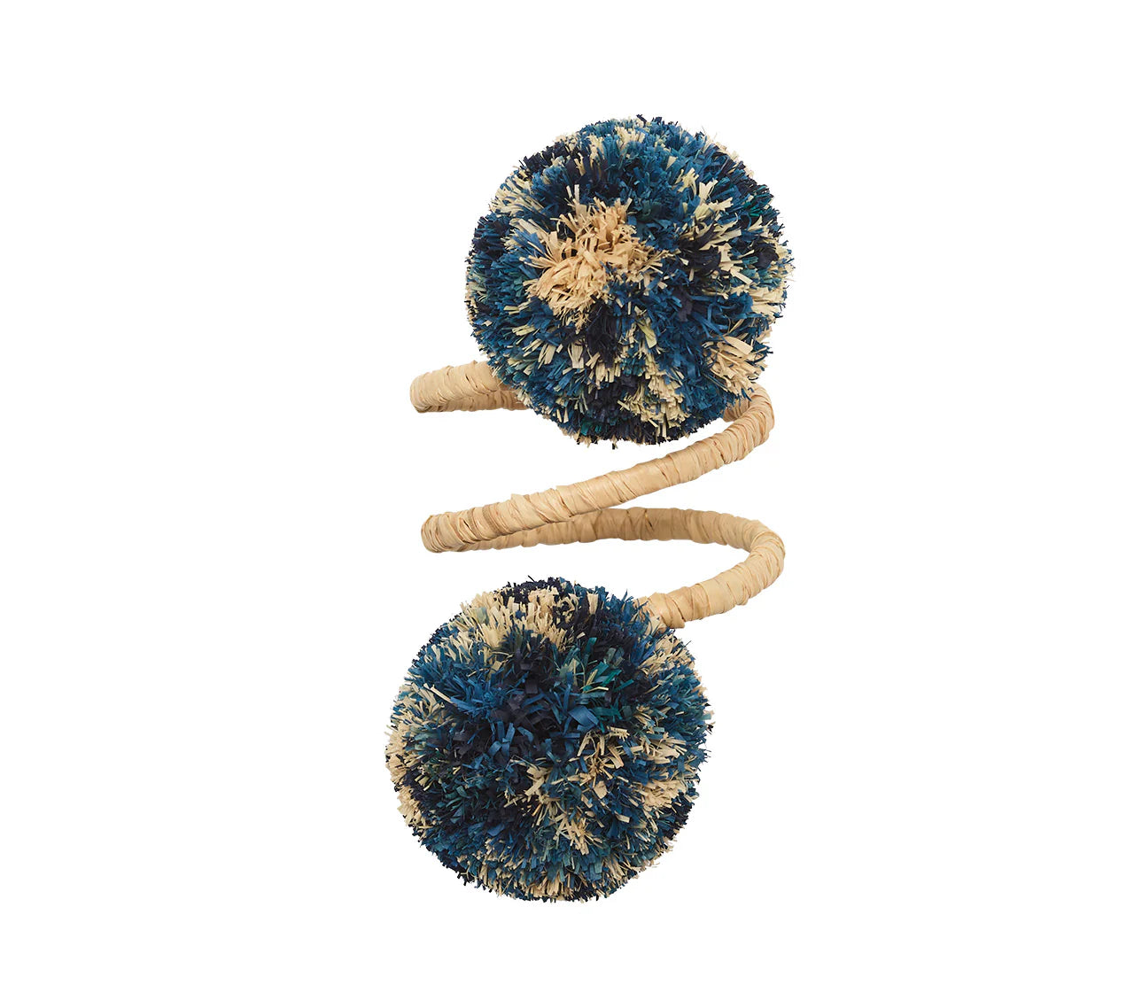 The Kim Seybert Casbah Napkin Ring displays organic elegance with a tan spiral coil and blue and beige yarn pom-poms on each end, shown isolated on a white background.