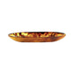 Part of the Tortoise Resin Serveware Collection, this oval plate features a marbled amber and brown design, ideal for serving or as a decorative accent. Shown on a white background.
