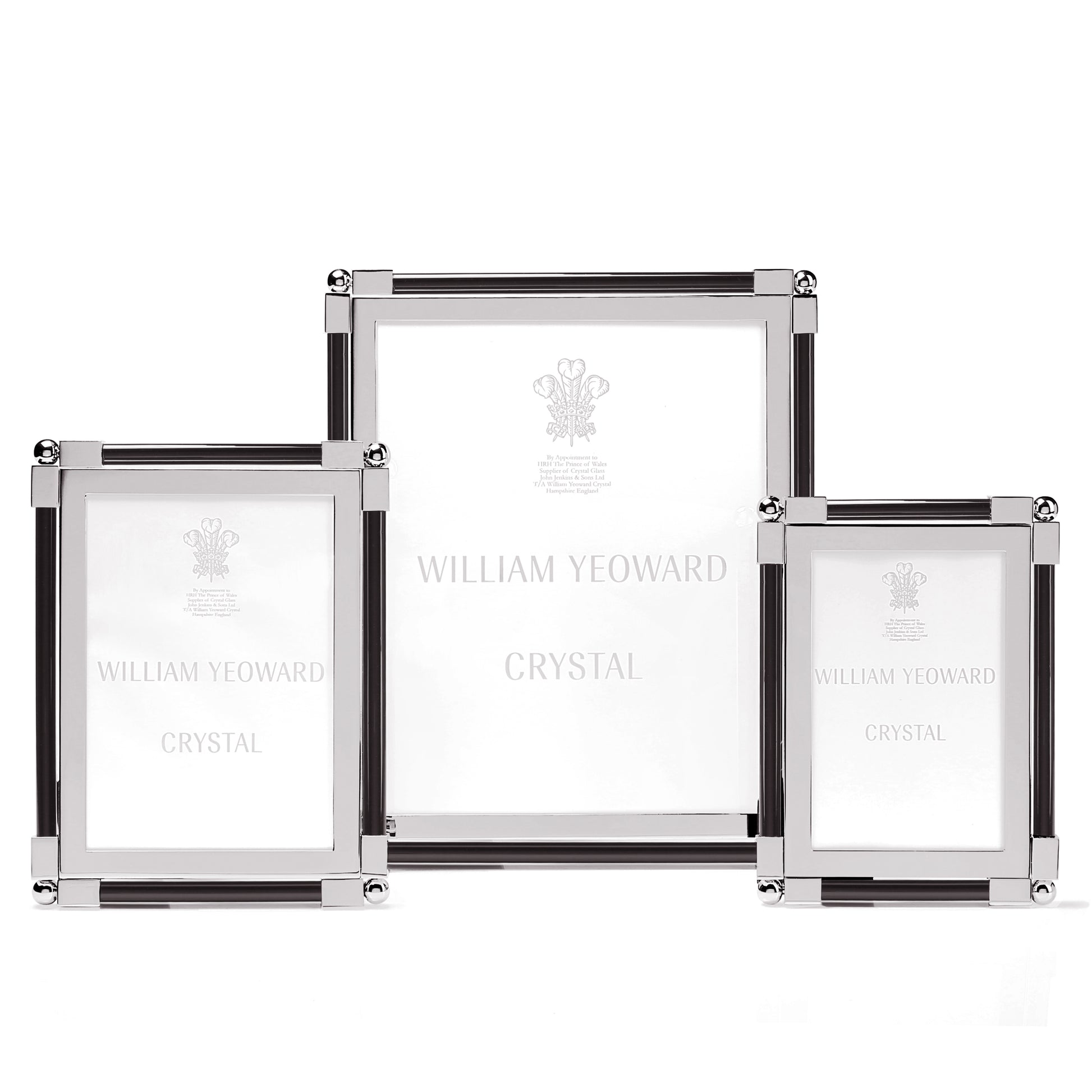 Three stylish photo frames from the William Yeoward Crystal Classic Black Frame Collection come in various sizes, featuring a nickel-plated bright finish and the "William Yeoward Crystal" text on the glass.