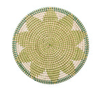 Kim Seybert Majorelle Placemat Collection: round woven wicker placemat crafted from natural seagrass with a green, beige, and white pattern and subtle floral motifs, shown on a white background.