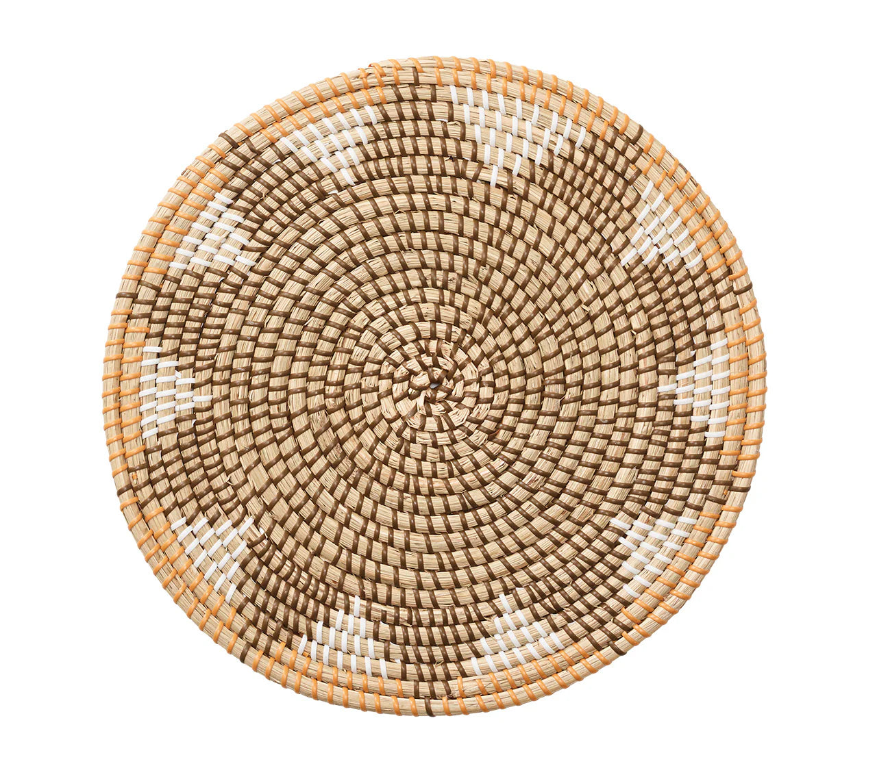 The Kim Seybert Majorelle Placemat Collection features round, woven basket trays made from natural seagrass with a geometric tan, brown, and white pattern, shown on a white background.