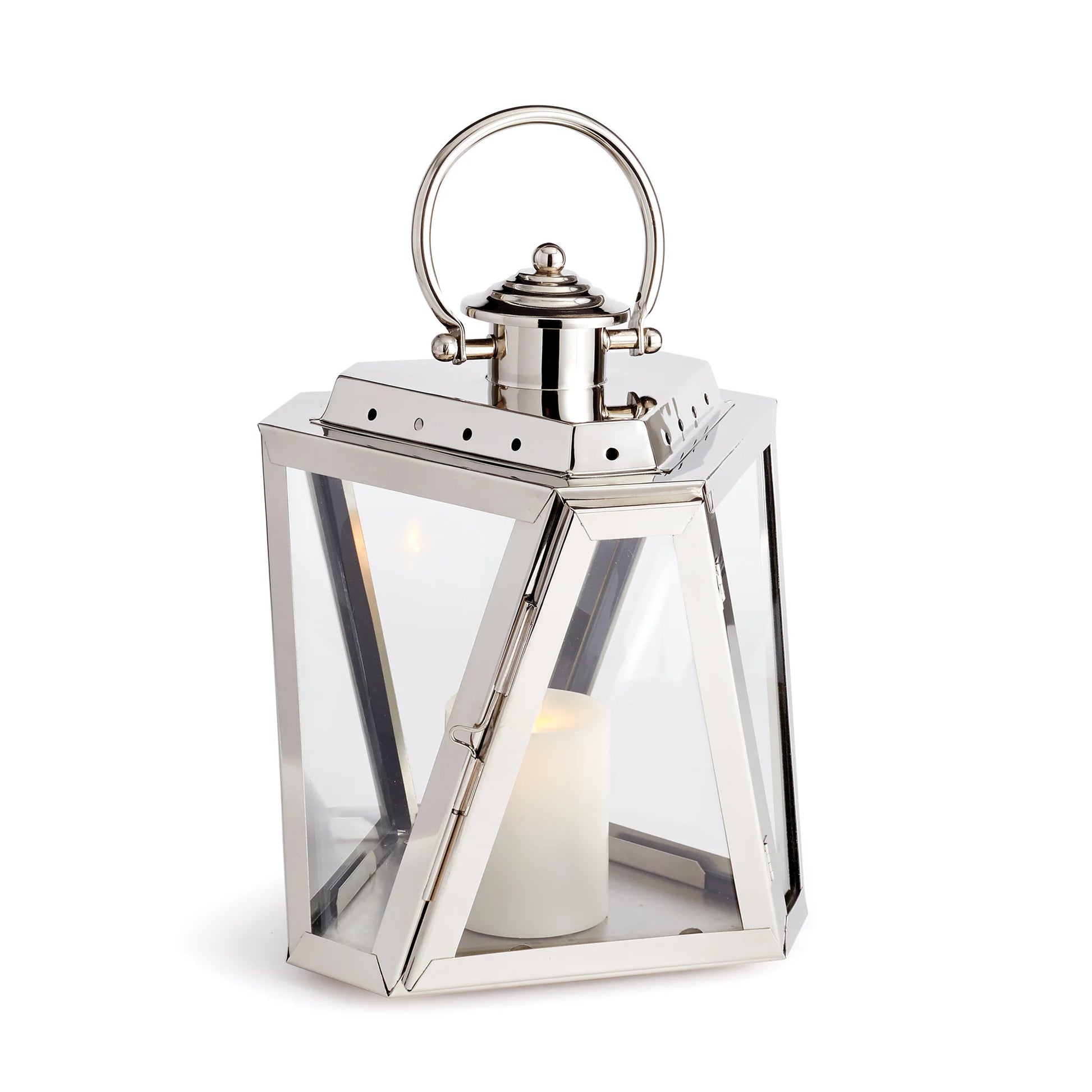 The Napa Adler Steel Outdoor Lantern features a silver metal and glass design with a chrome finish, a top handle, and includes a white LightLi pillar candle inside.