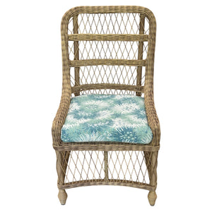 Outdoor Lemonade Chair in Bimini Seaglass features a high, open-weave lattice back and a blue-green seat cushion with white leafy patterns, combining elegance and charm from the Lemonade Collection.