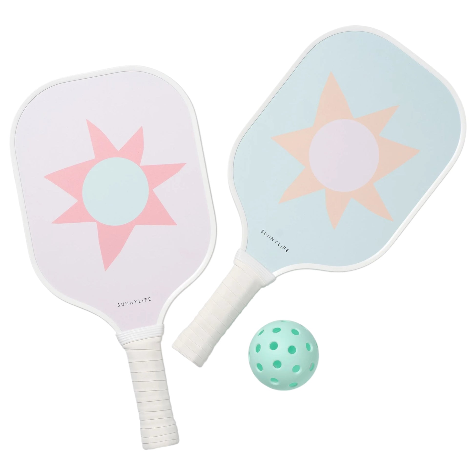 The SUNNYLiFE Pickleball Set in Rio Sun Multi features two pastel paddle rackets with sun designs and a perforated mint-green ball, all crafted with a durable polymer honeycomb core for high performance, arranged on a white background.