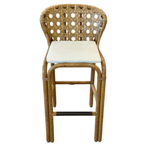 The Exalt Barstool in Pecan offers a classic design with a rattan woven backrest, cushioned seat, and straight pecan wood legs with a footrest.
