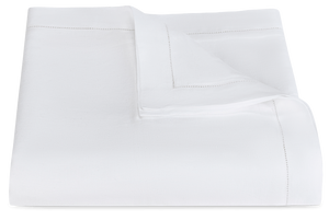 A folded white blanket with hemstitch detailing along the edges, displayed against a plain background, showcasing the craftsmanship found at Matouk's factory.

Revised Sentence: A folded white blanket with hemstitch detailing along the edges, displayed against a plain background, showcasing the craftsmanship found in the Matouk Roman Linen Hemstitch Bedding Collection, White.