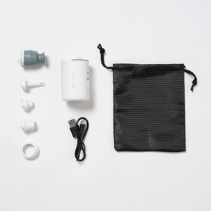 The SUNNYLiFE Electric Air Pump comes in white with four nozzle attachments, a USB charging cable, a black drawstring pouch, and a white ring—everything you need for easy inflation and organized travel.