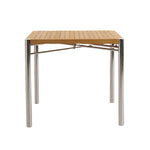 The Sundeck Folding Table is a square teak dining table with a perforated wooden top and four cylindrical marine-grade stainless steel legs, displayed against a plain white background.